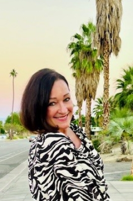 Demetria near palm trees