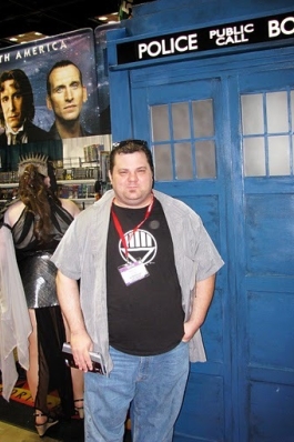 A photo of Eddie next to the Dr. Who telephone booth