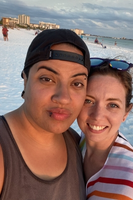 A photo of Jesi and her partner at the beach in St. Pete.