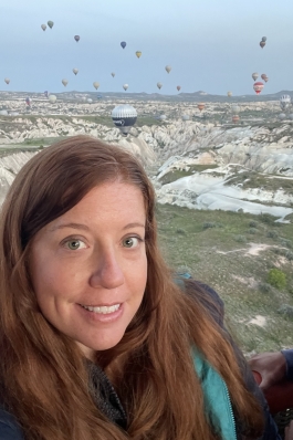 A photo of Rachel in front of hills in Turkey.