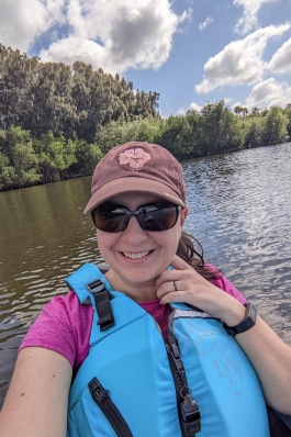 Charity Stewart on a boat in a blue lifevest