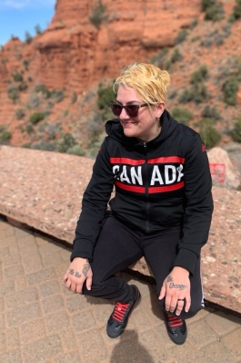 A photo of Lori behind a canyon