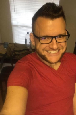 A selfie of Jason wearing a red shirt