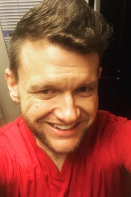 A selfie of Jason wearing a red shirt