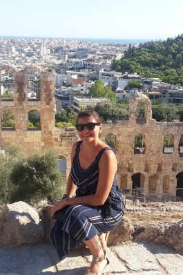 A photo of Nicole in front of ruins in Athens.