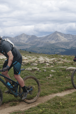A photo of Josh biking down a hill in Colorado.