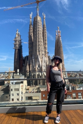A photo of Christie behind a Spanish monument.
