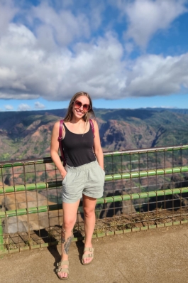 Christie overlooking mountains in Hawai'i