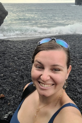 A photo of Emily on a beach in Hawaii.