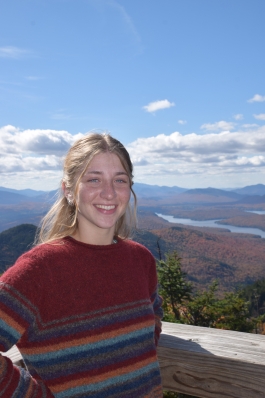 A photo of Layne with a scenic Lake Placid backdrop.